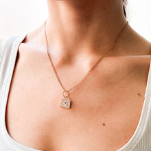 Load image into Gallery viewer, Necklace with a purse shaped pendant worn by a person

