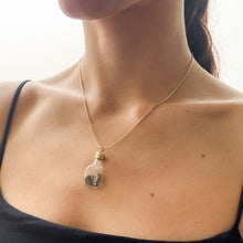 Load image into Gallery viewer, Vintage 1970s Glass Bottle with Gold Flakes Pendant
